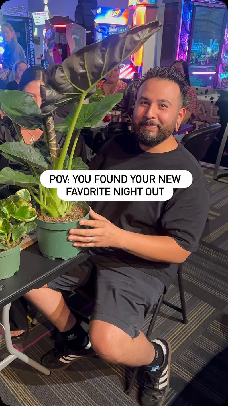 A Plant Bingo guest smiling with the houseplant he won